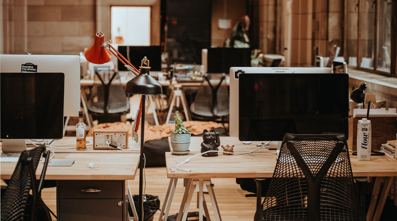 Computers and office chairs in an empty office
