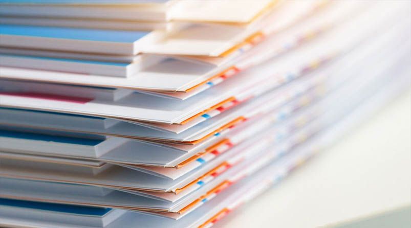 people in meeting around table in office