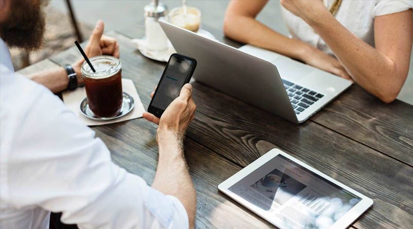people in meeting around table in office