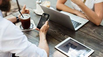 people in meeting around table in office